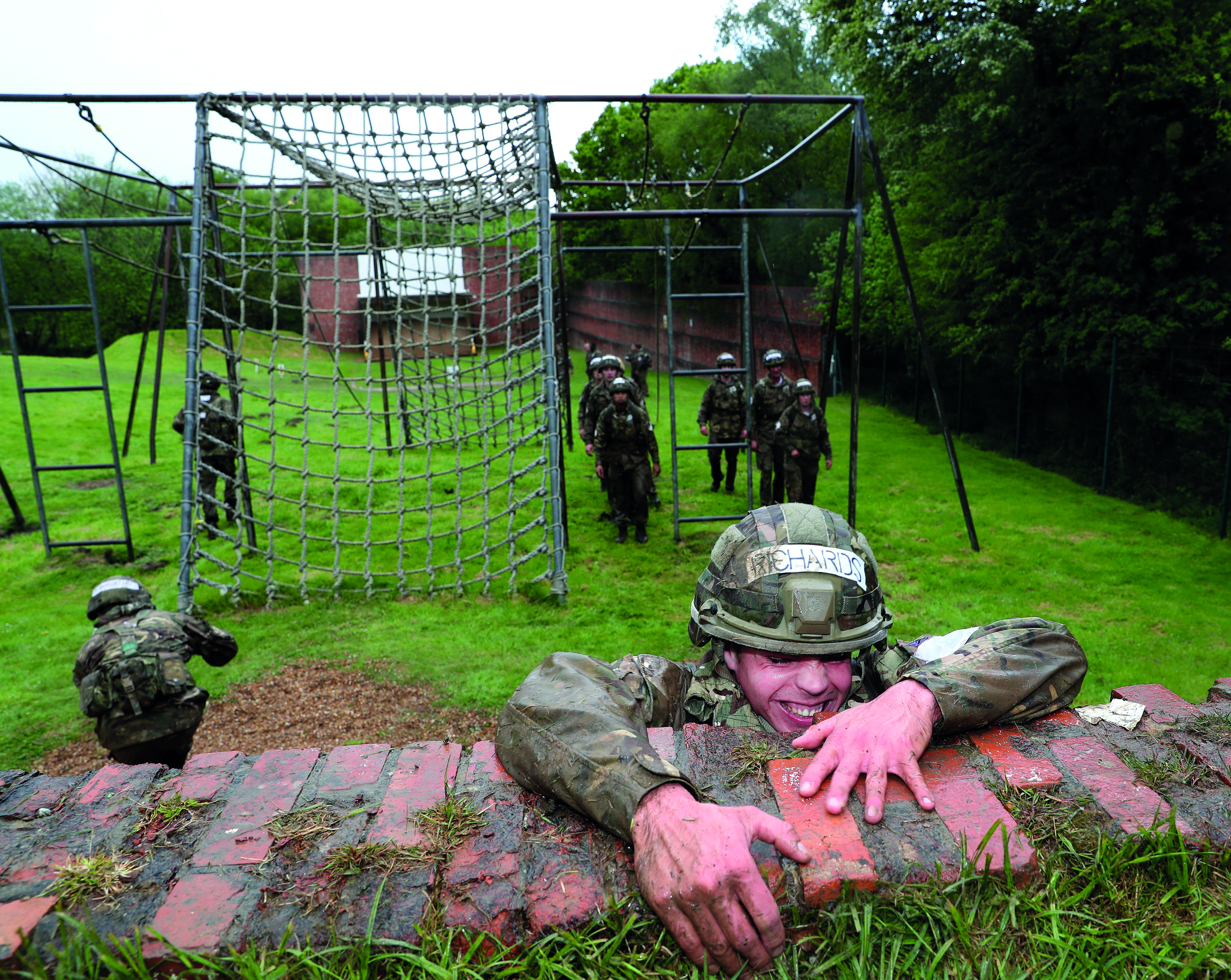 Soldiers training on a assault course