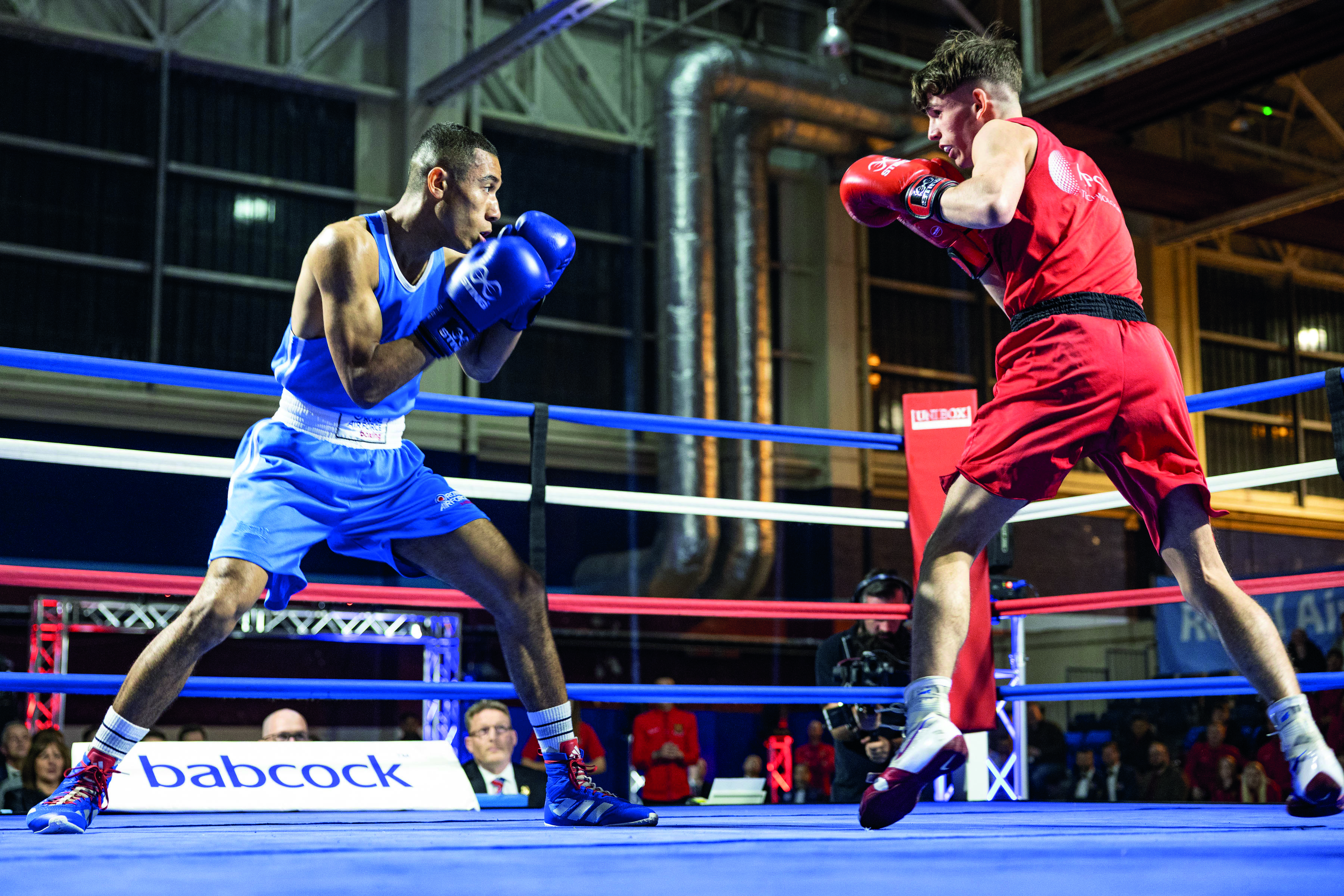 Two boxers fighting in the ring