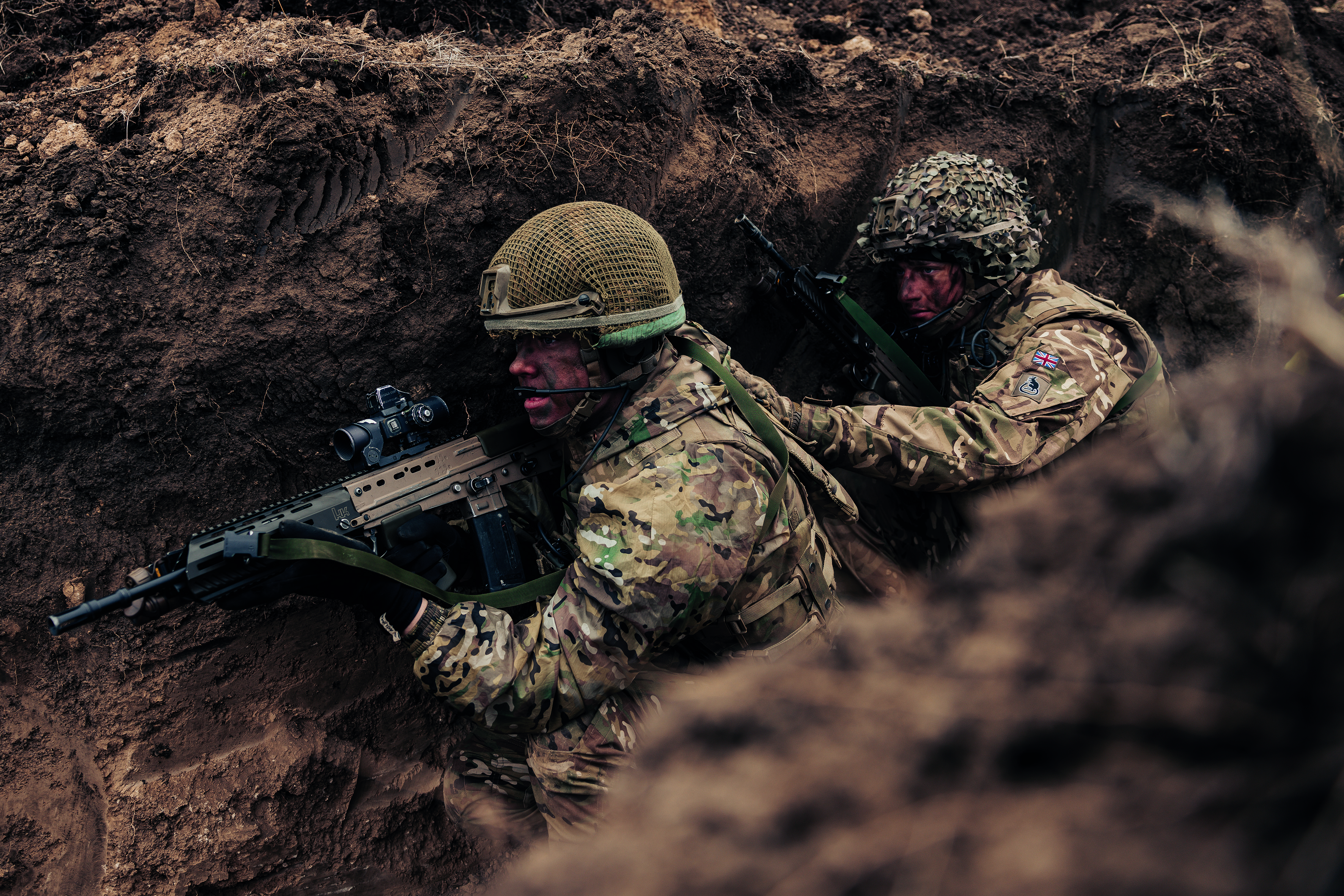 Two soldiers hiding in the trenches 