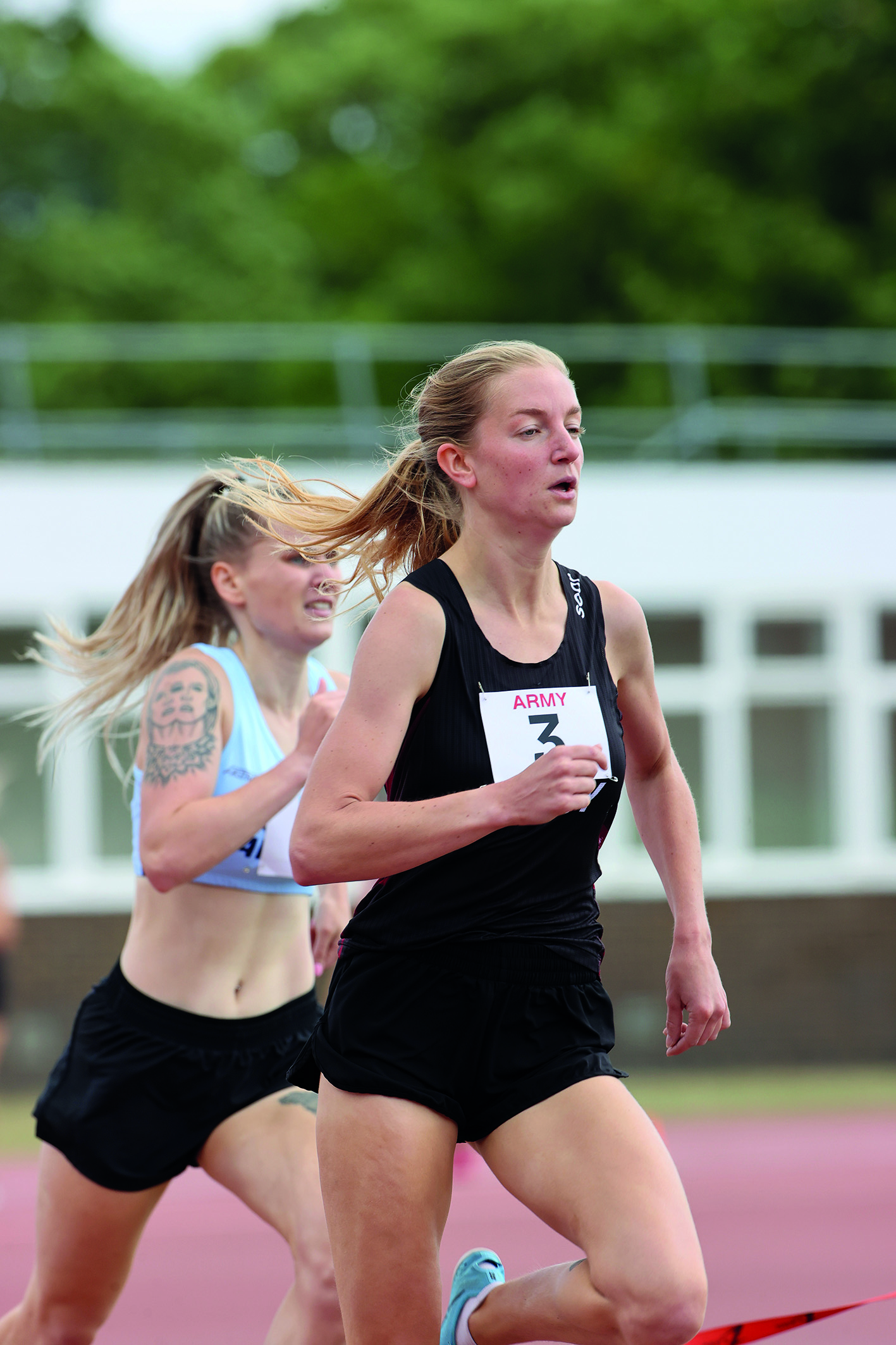 Two female runners racing against each other