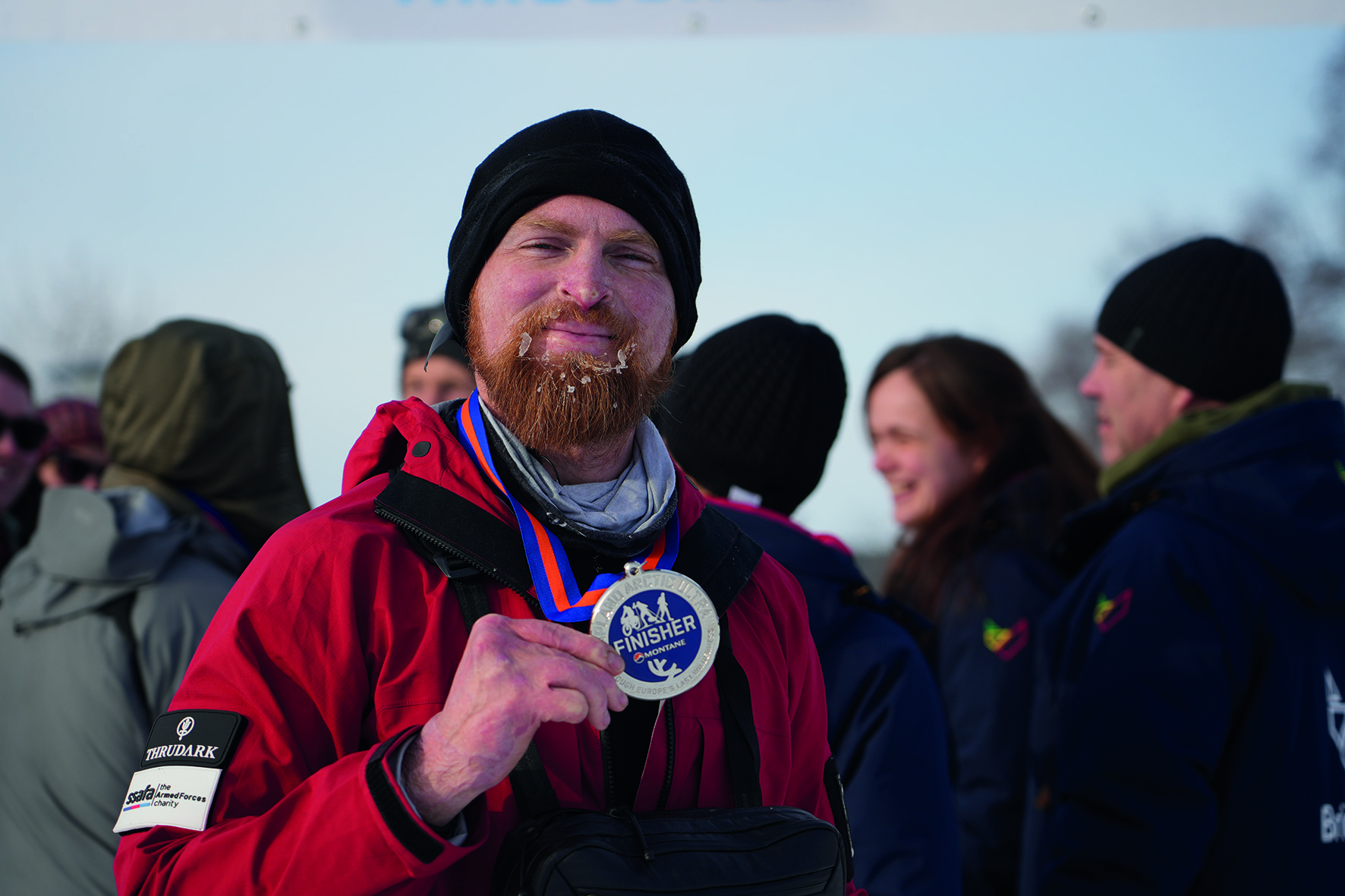 Garrath Williams holding medal around his neck