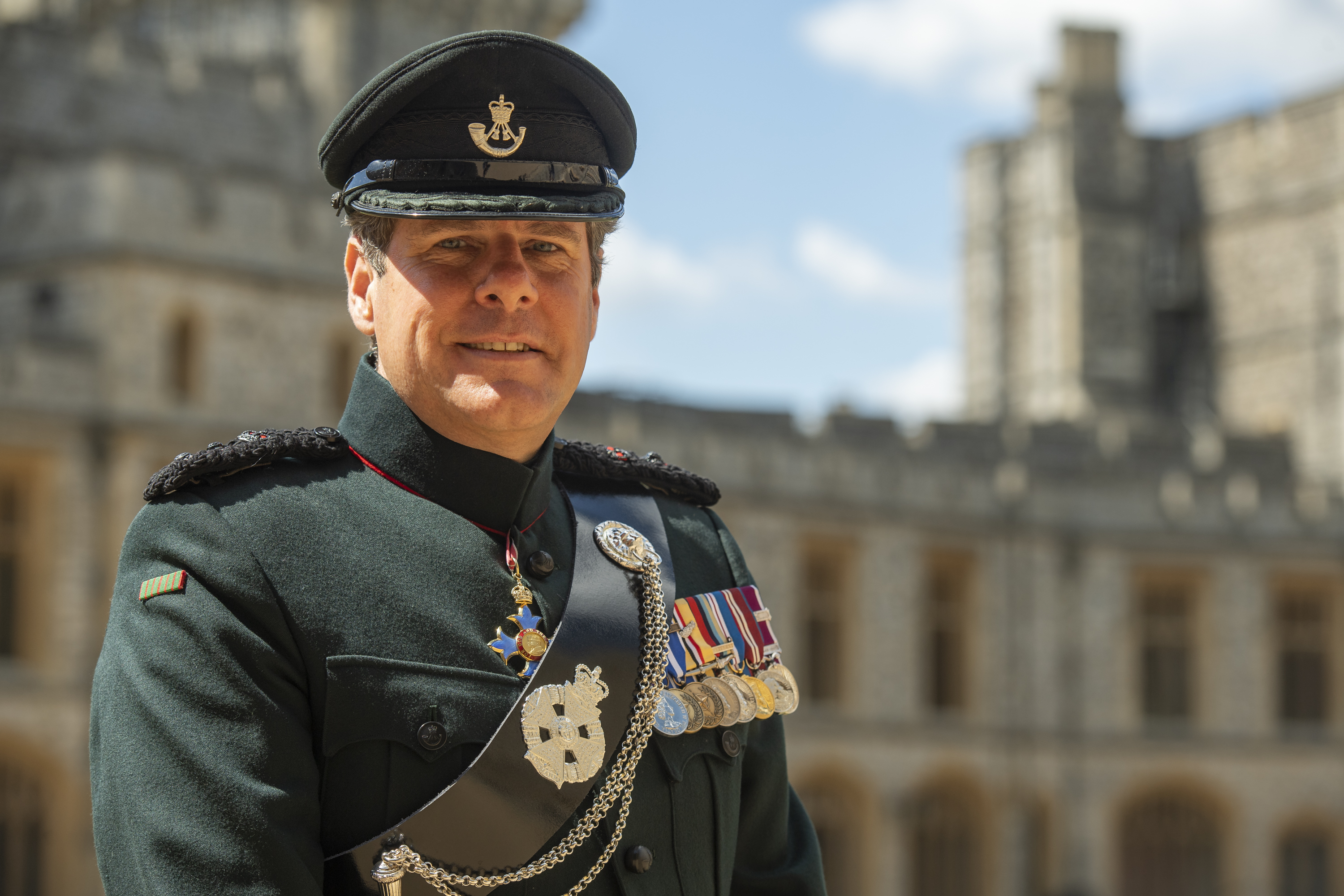 Decorated male soldier smiling at the camera