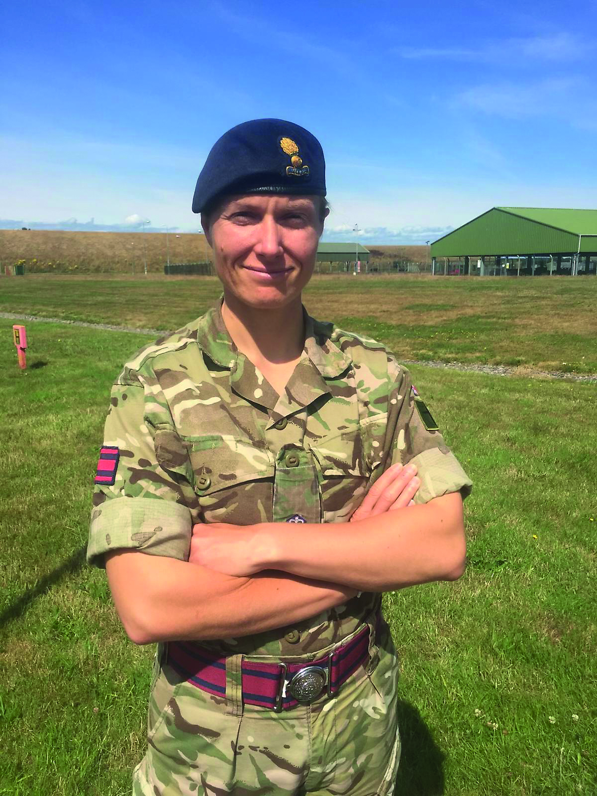 Female soldier smiling at the camera