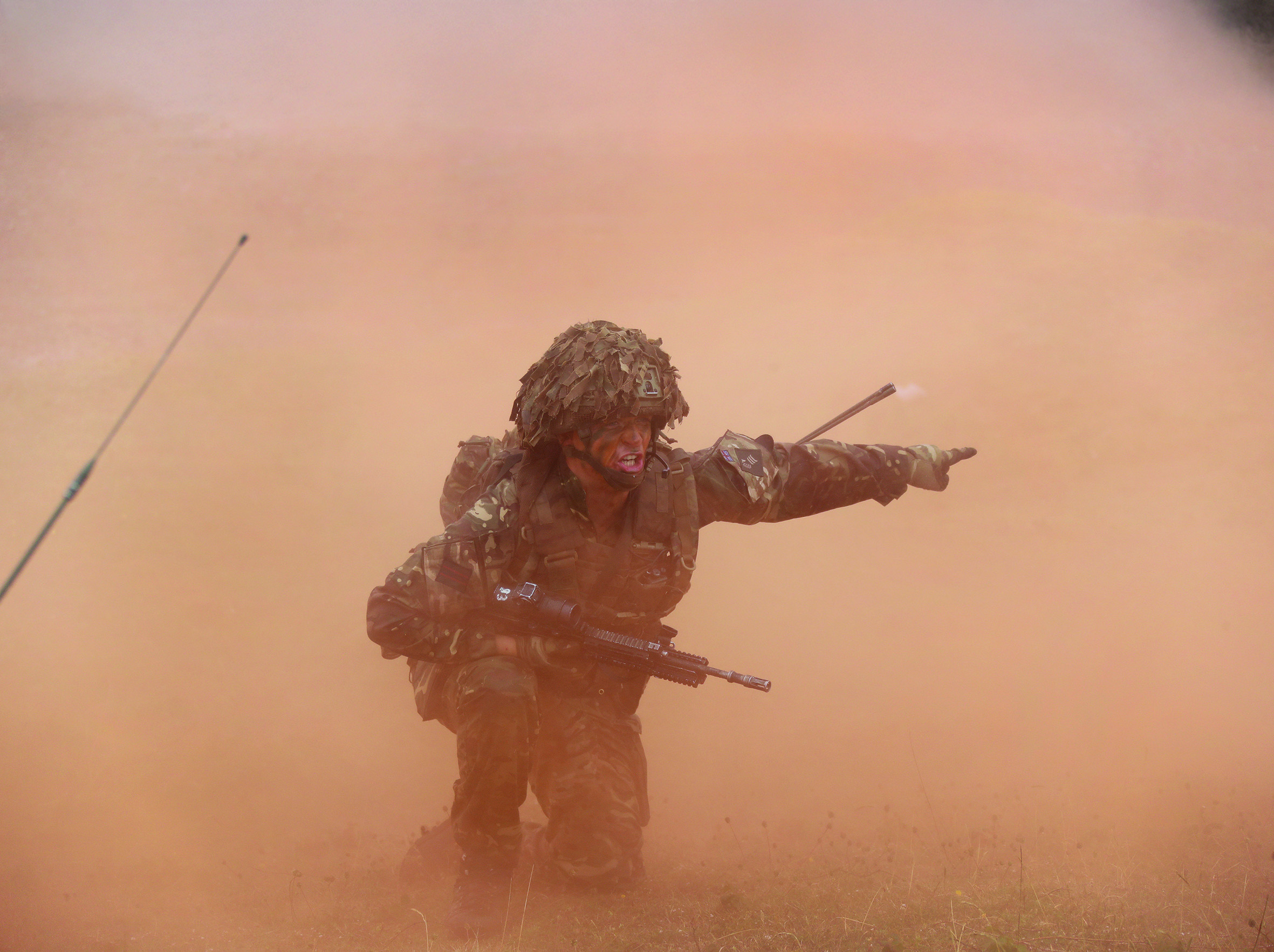 Soldier pointing and shouting in red fog