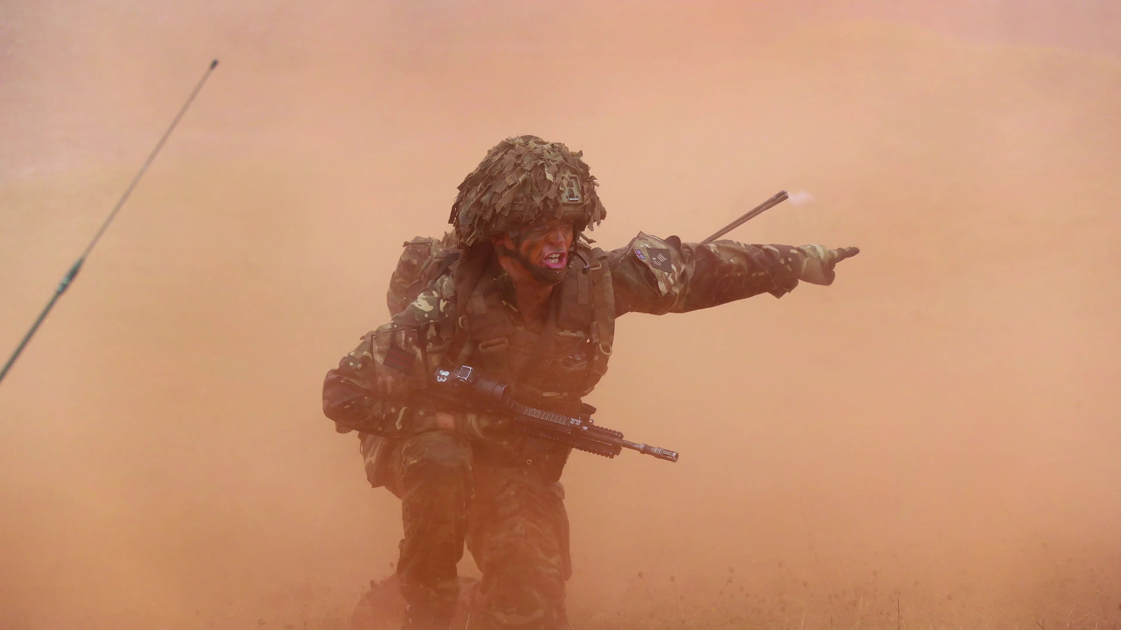 Soldier pointing and shouting in red fog