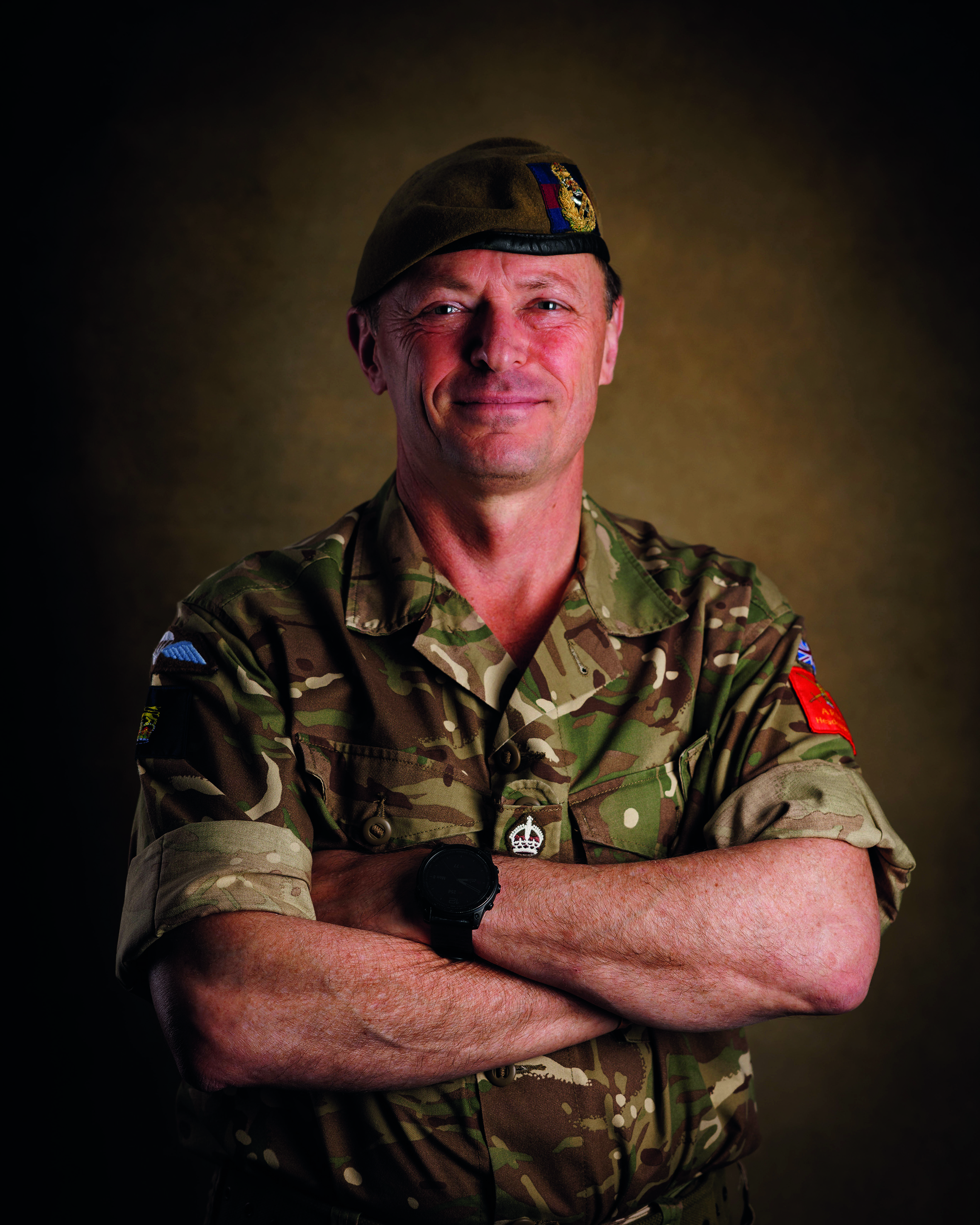 Male army soldier portrait smiling at the camera