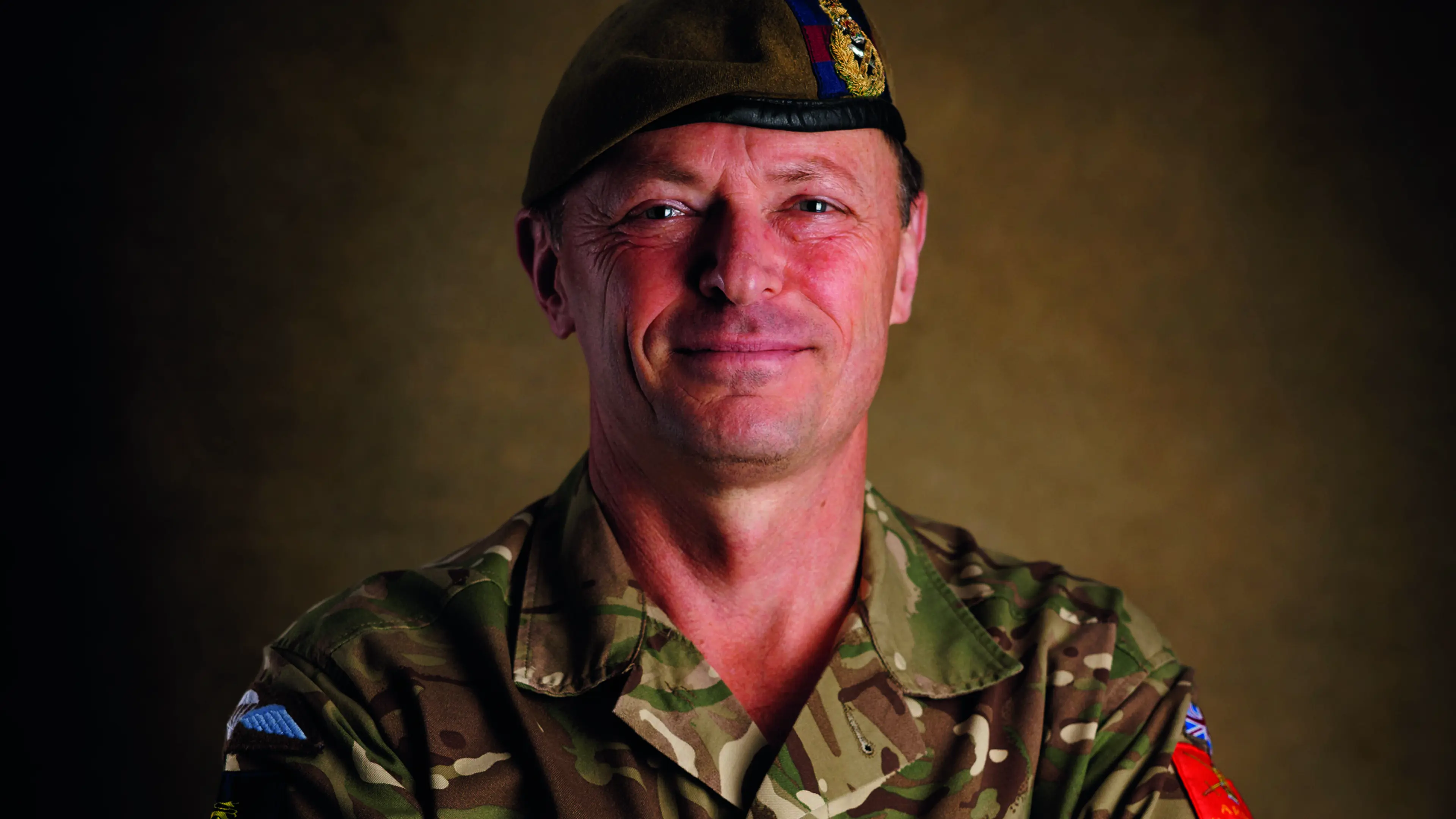 Male army soldier portrait smiling at the camera